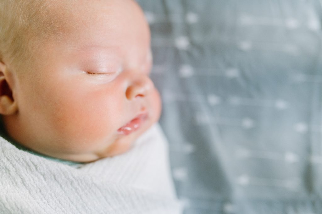 close up of baby's face during photoshoot in Milwaukee by a Wisconsin newborn photographer 