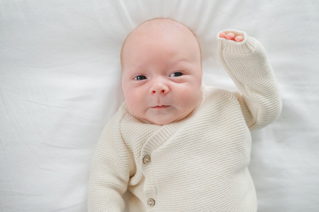 Photo of two month old baby laying on the bed taken by Abby Park Photography